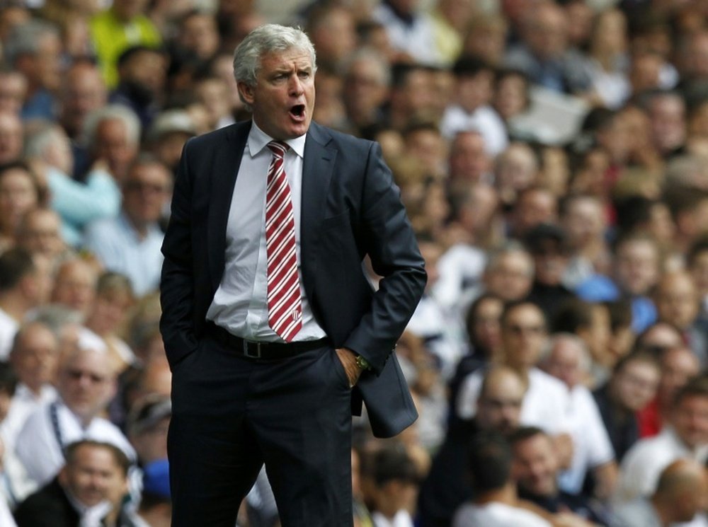 Stoke Citys Welsh manager Mark Hughes gestures during the English Premier League football match between Tottenham Hotspur and Stoke City at White Hart Lane in north London on August 15, 2015