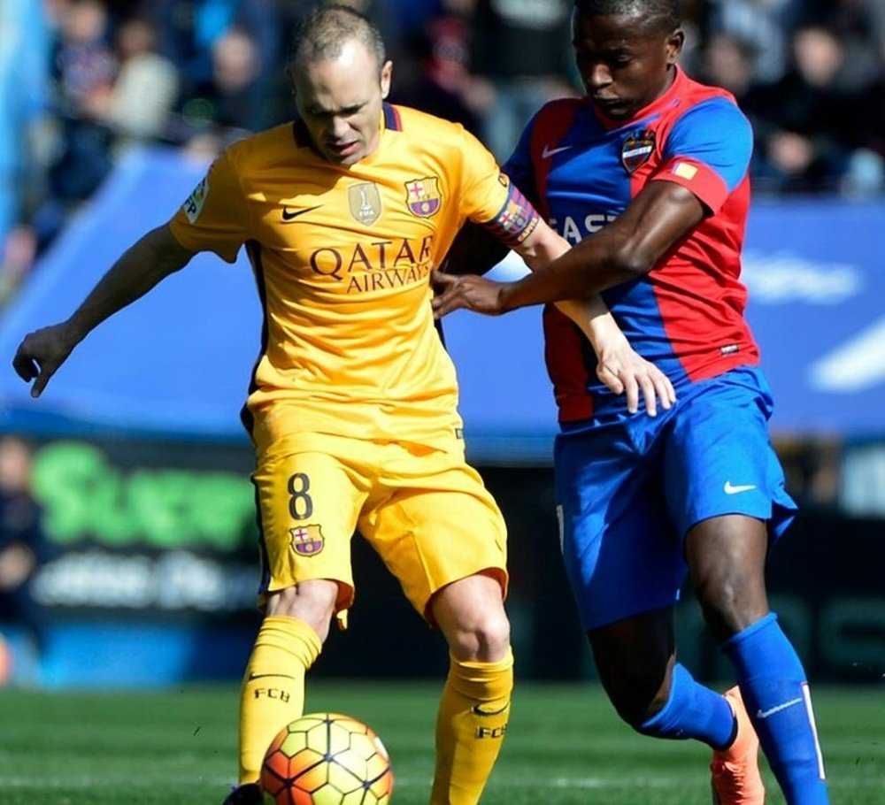 Skipper Andres Iniesta (left) admits Barcelona were far from their best despite winning 2-0 at bottom of the table Levante