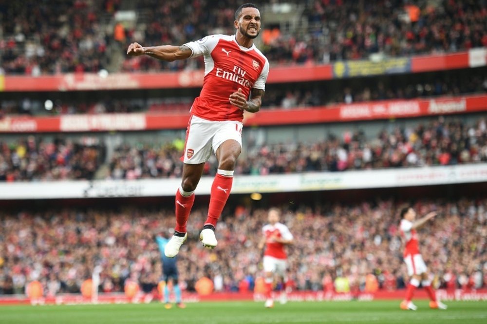 Theo Walcott celebrates after scoring Arsenals second goal against Swansea City at the Emirates Stadium on October 15, 2016