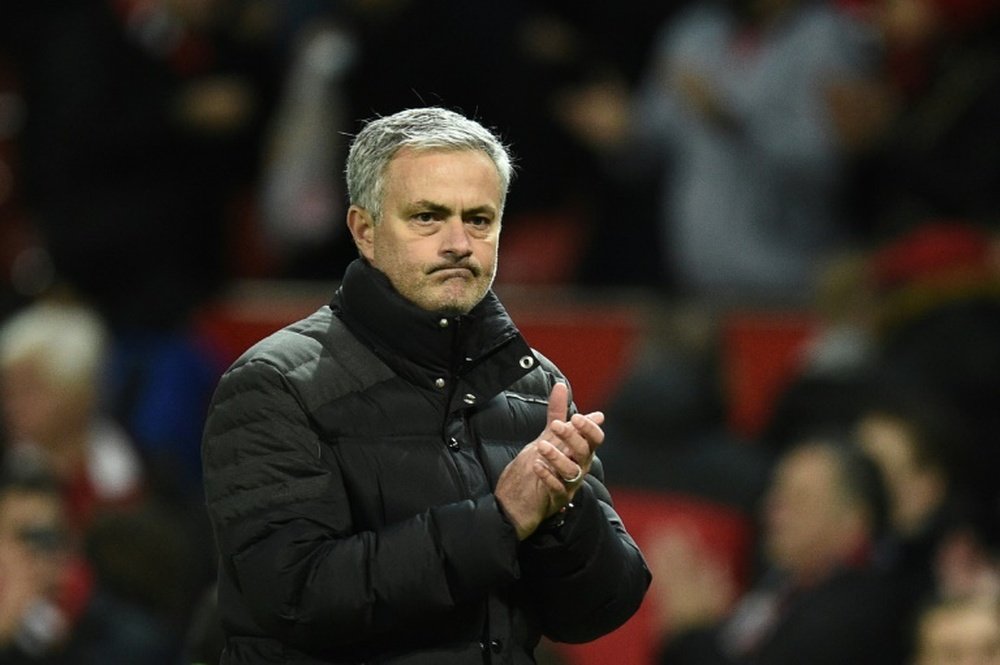 Manchester Uniteds manager Jose Mourinho applauds after the English Premier League football match on December 11, 2016