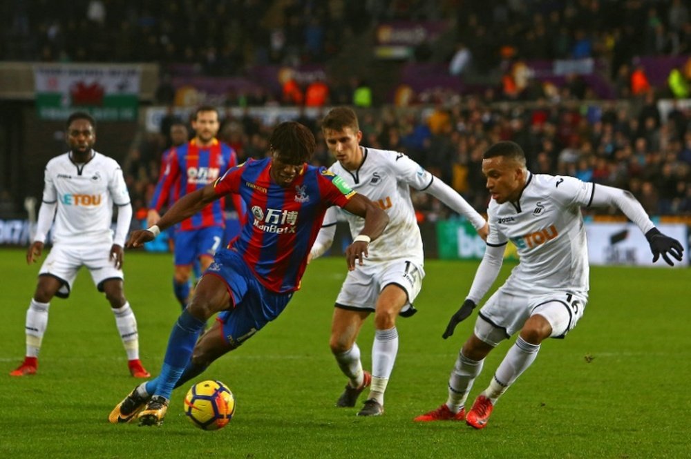 Zaha's pace and ability inspire fear in opposition defenders. AFP