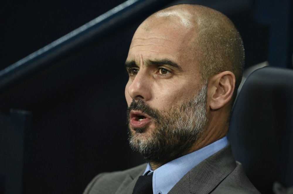 Manchester Citys Spanish manager Pep Guardiola watches during their match against Barcelona. AFP