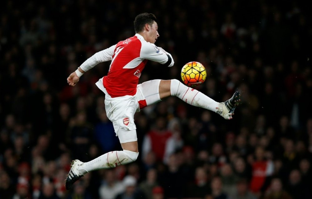 Arsenals midfielder Mesut Ozil has an unsuccessful shot during the English Premier League football match between Arsenal and Bournemouth at the Emirates Stadium in London on December 28, 2015