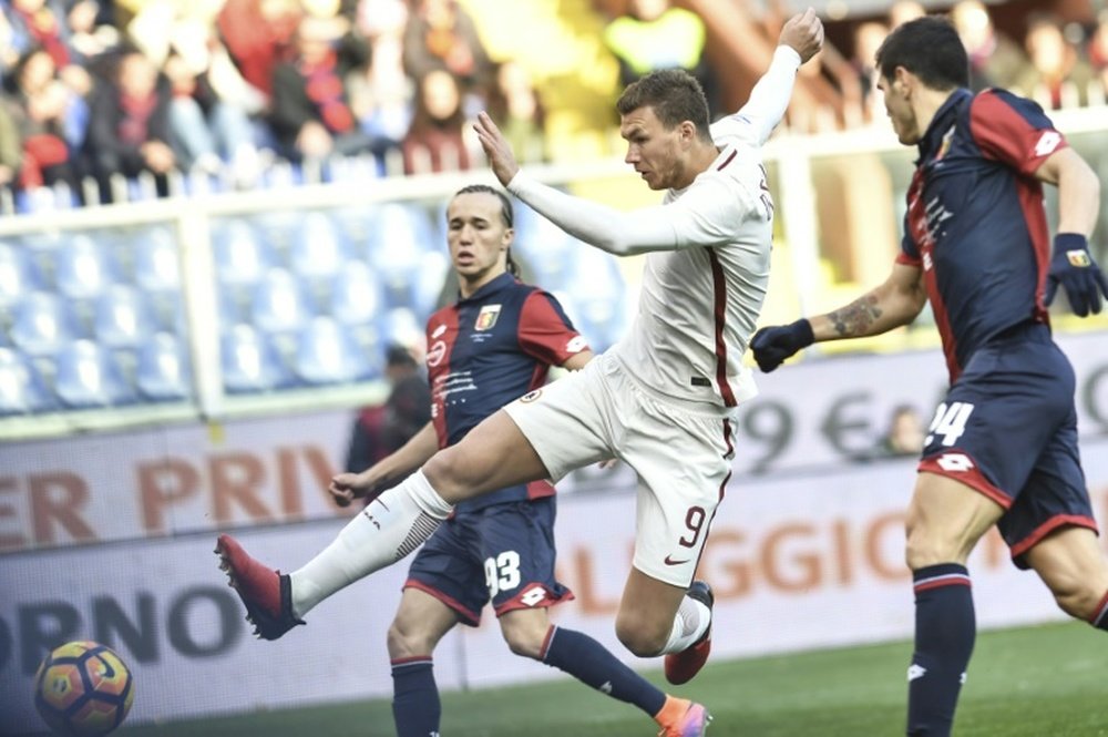Roma forward Edin Dzeko kicks the ball during the match against Genoa. AFP