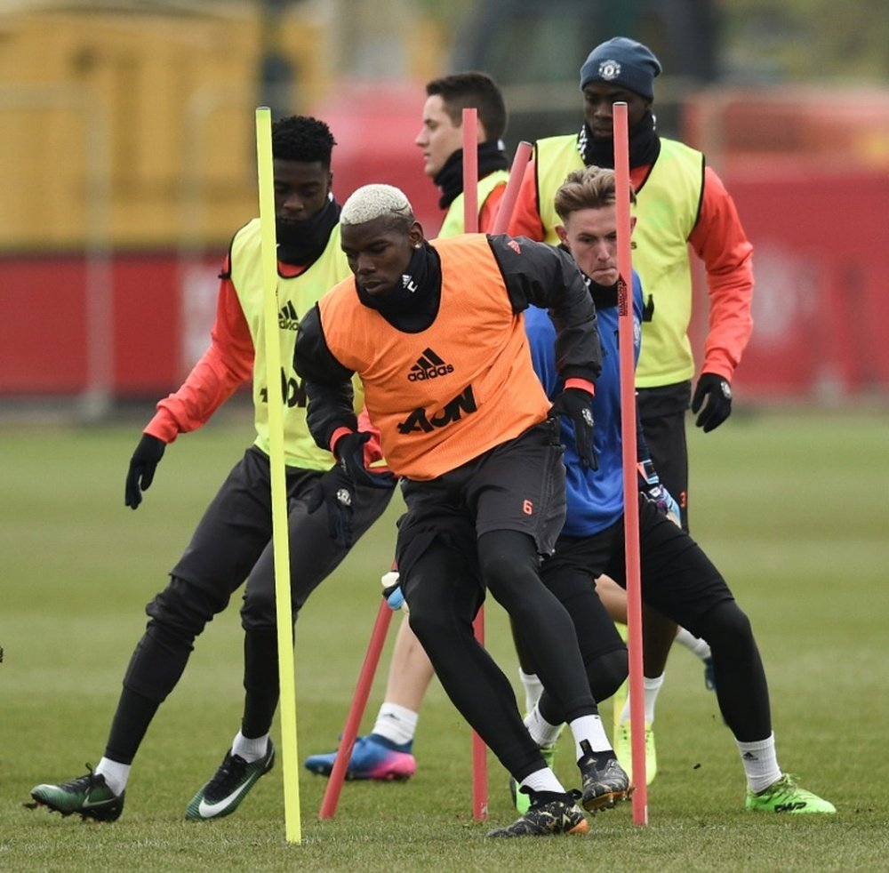 Manchester United players in action during a training session at their Carrington. AFP