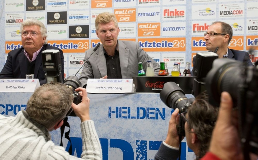 Ex-Germany international Stefan Effenberg (C) speaks during a press conference to present himself as new coach of German second division Bundesliga football club SC Paderborn on October 14, 2015 in Paderborn, northwestern Germany