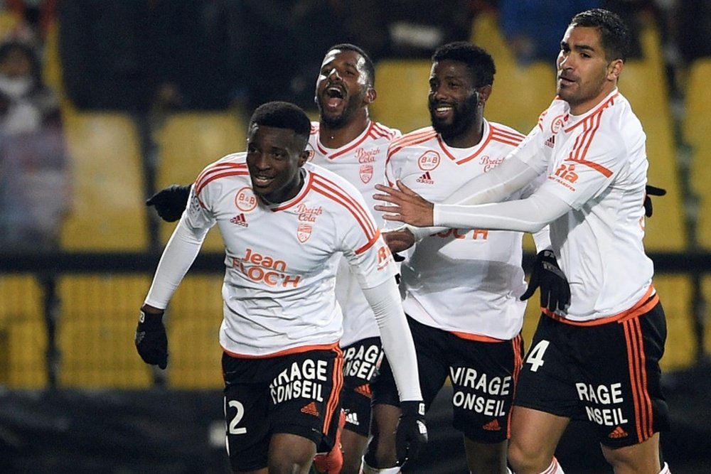 Benjamin Moukandjo celebrates with his Lorient teamamtes after scoring a goal during in Ligue 1. AFP