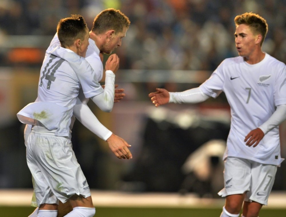 New Zealands Chris Wood (C) celebrates scoring a goal with teammates during a friendly match in Tokyo