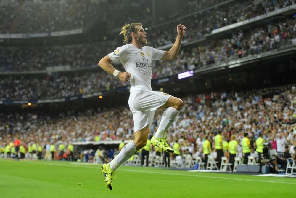 Real Madrids Welsh forward Gareth Bale celebrates after scoring his second goal during the Spanish league match against Real Betis Balompie at the Santiago Bernabeu stadium in Madrid on August 29, 2015
