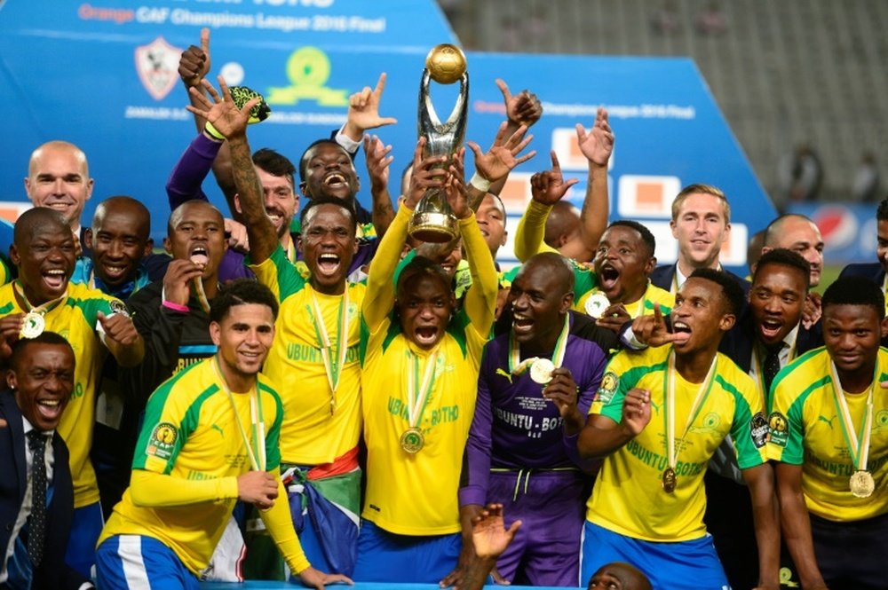 Mamelodi Sundowns players celebrate after winning the CAF Champions League . AFP