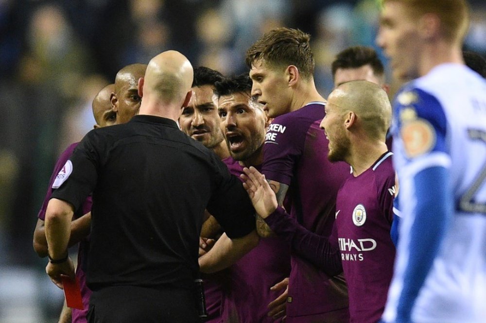 City were fined after their players surrounded the referee in their game against Wigan. AFP