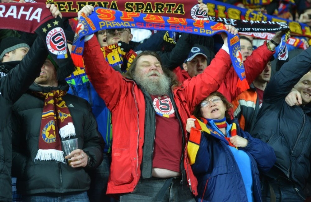 Fans of Sparta Praha wave their scarves before the UEFA Europa League Round of 16 first-leg football match between Sparta Prague and Lazio Rome in Prague, Czech Republic on March 10, 2016