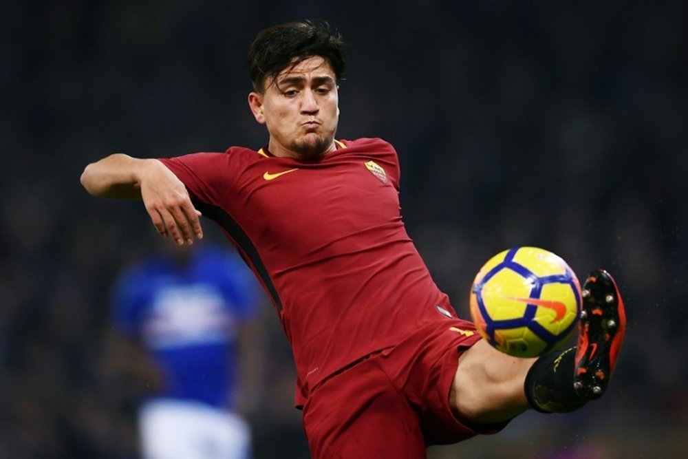 Cengiz gets 10-man Roma back winning. AFP