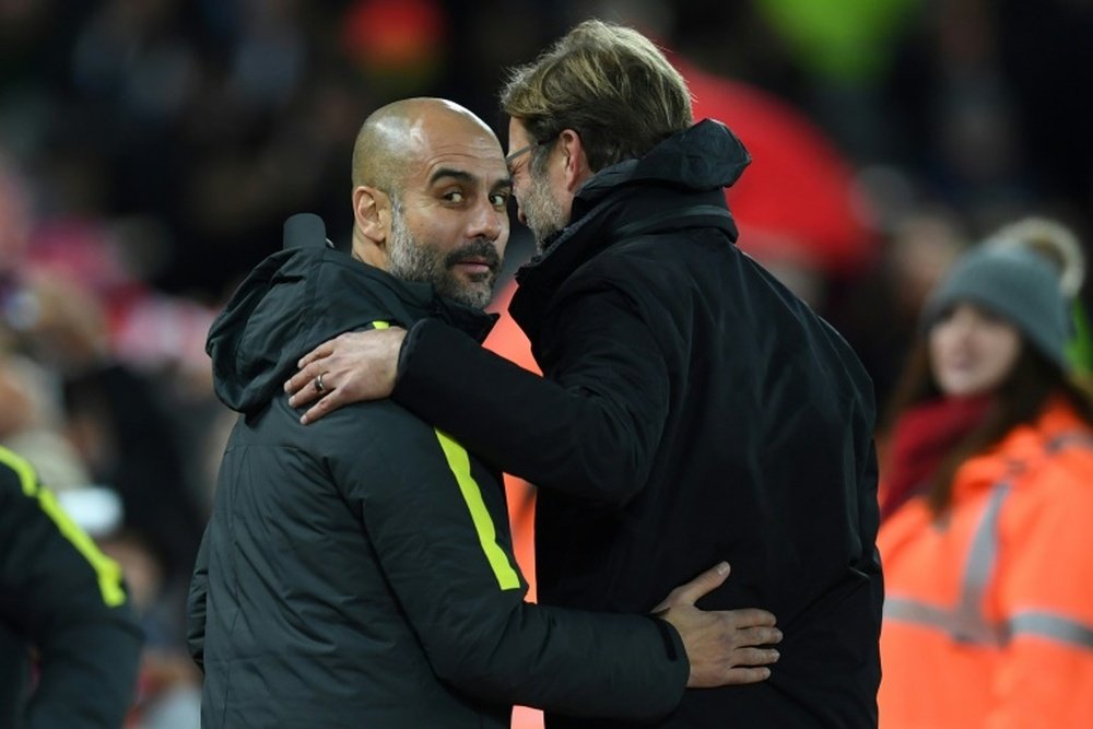 Guardiola and Klopp are up for Manager of the Year. AFP