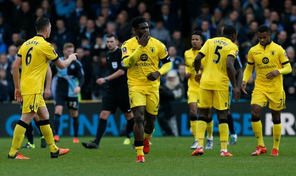 Aston Villas defender Micah Richards (C) celebrates scoring a goal during the FA Cup third-round football match between Wycombe Wanderers and Aston Villa at the Adams Park stadium in High Wycombe, west of London on January 9, 2016