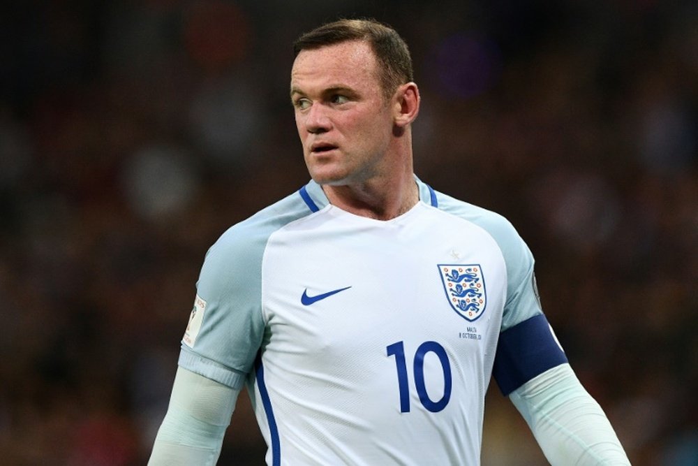 England captain Rooney was let down by the FA, according to Wenger. AFP