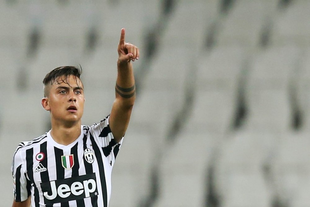 Juventus Argentinian forward Paulo Dybala celebrates after scoring during the Italian Serie A football match between Juventus and Chievo on September 12, 2015 at the Juventus Stadium in Turin