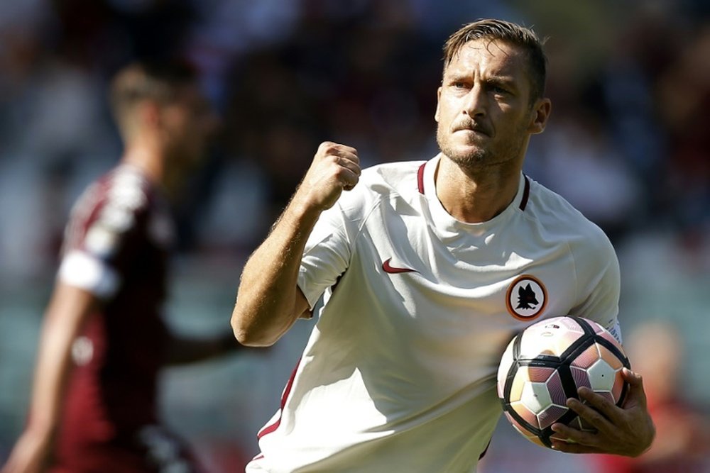 Totti celebrates after scoring a goal during the Italian Serie A match against Torino. AFP