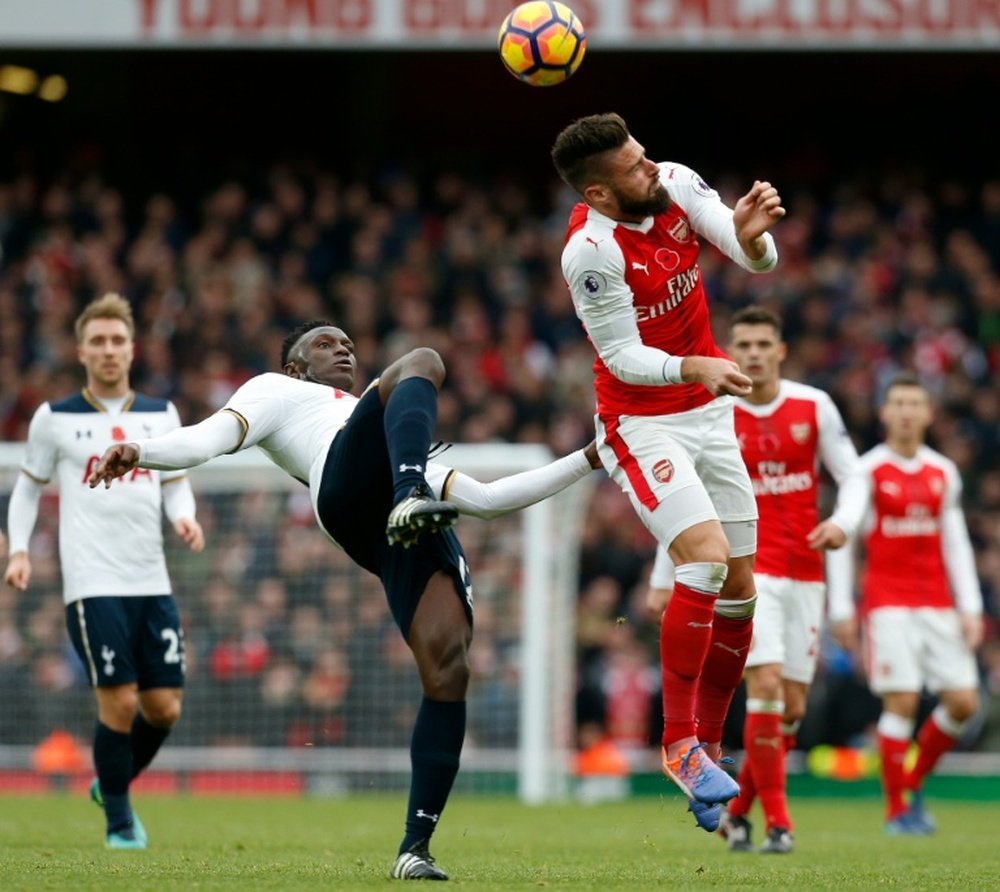 Giroud heads the ball during the north London derby. AFP
