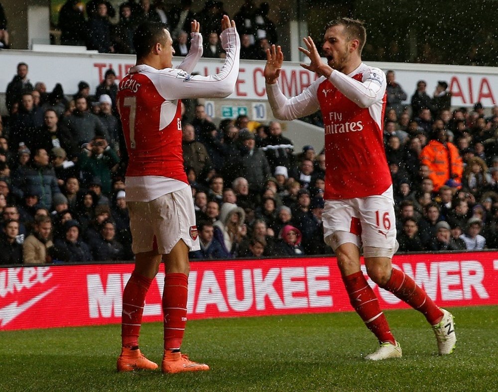 Sanchez (L) and Ramsey celebrate scoring against Spurs last season. AFP