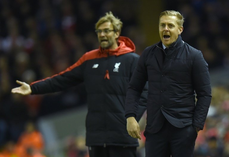 Monk and Klopp managing in 2016. AFP