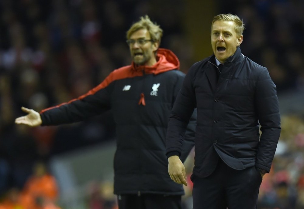 Monk and Klopp managing in 2016. AFP