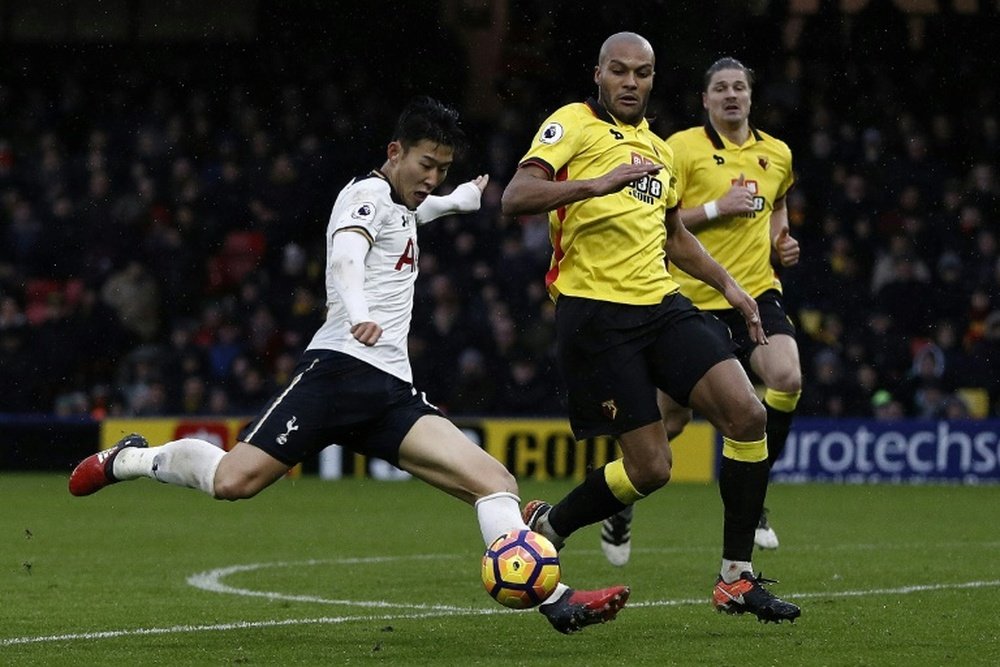 Tottenham Hotspurs Son Heung-Min (L) shoots but fails to score against Watford on January 1, 2017
