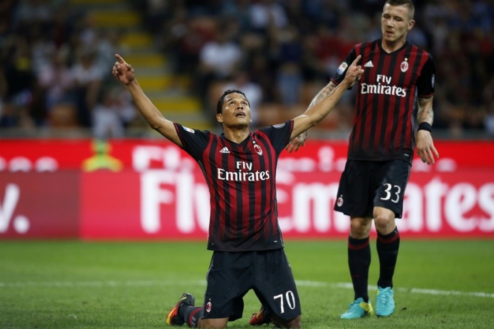 AC Milans forward Carlos Bacca from Colombia (L) celebrates after scoring on October 2, 2016