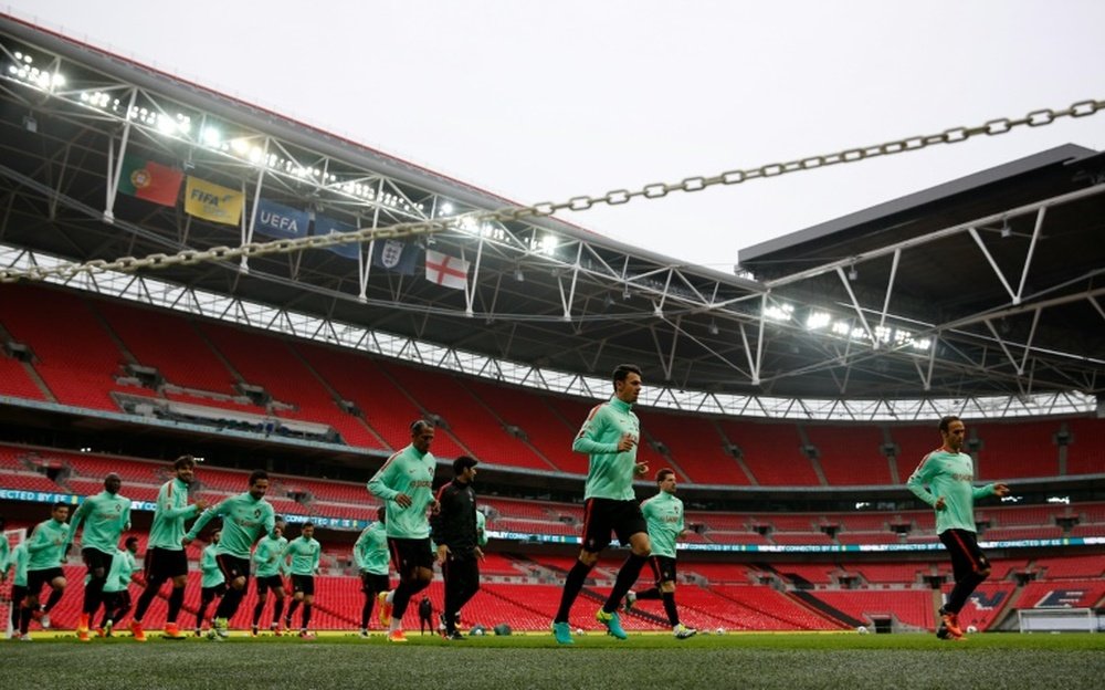 Portugal players warm up during a training session at Wembley Stadium. BeSoccer