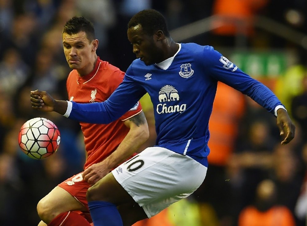 Liverpool's Dejan Lovren (L) fights for the ball with Everton's top scorer this season, Romelu Lukaku, during their English Premier League match, at Anfield in Liverpool, on April 20, 2016