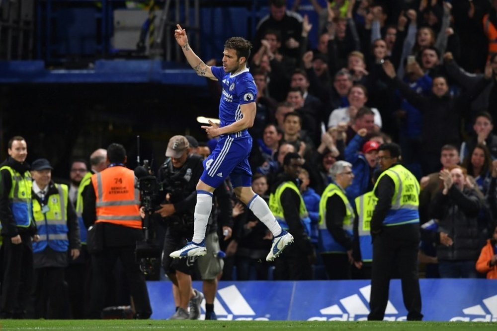 Chelseas midfielder Cesc Fabregas celebrates scoring their fourth goal on May 15, 2017