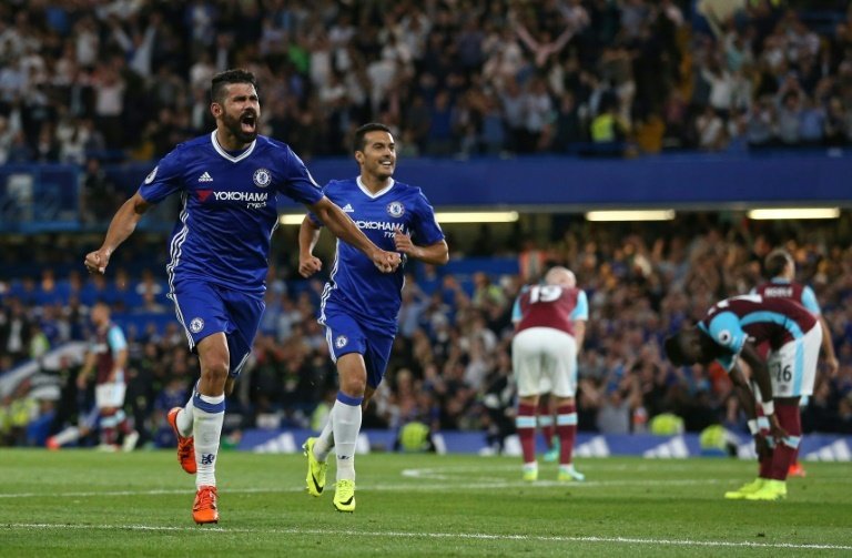 Chelseas Diego Costa (L) celebrates after scoring a goal during their English Premier League match against West Ham United, at Stamford Bridge in London, on August 15, 2016