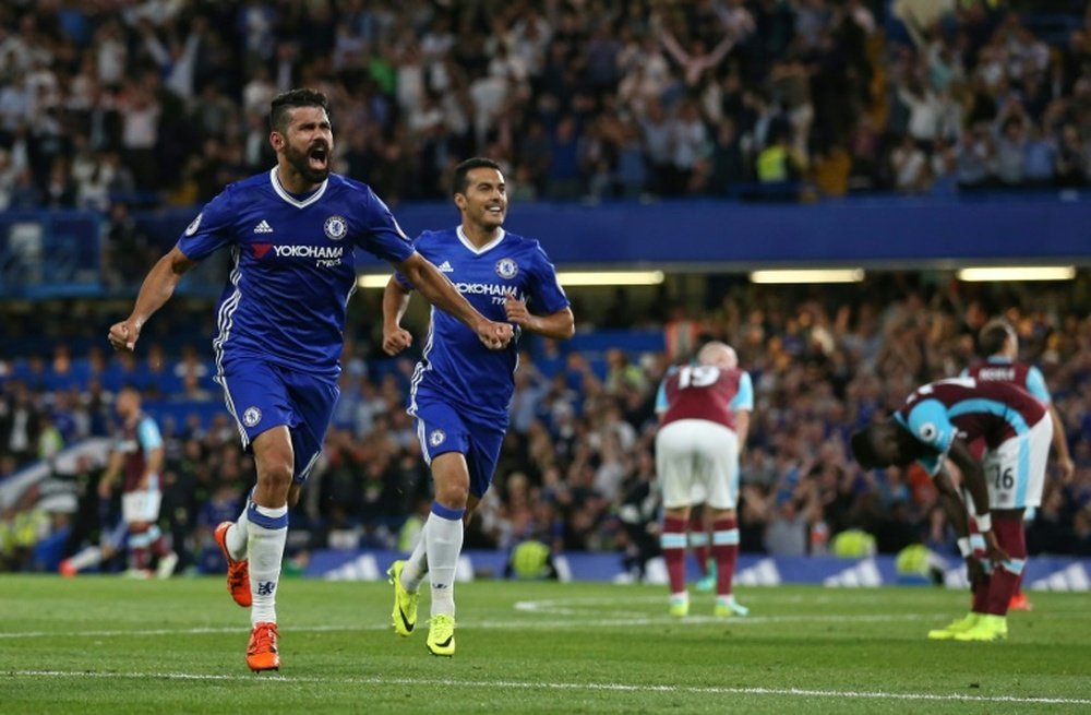 Chelseas Diego Costa (L) celebrates after scoring a goal during their English Premier League match against West Ham United, at Stamford Bridge in London, on August 15, 2016