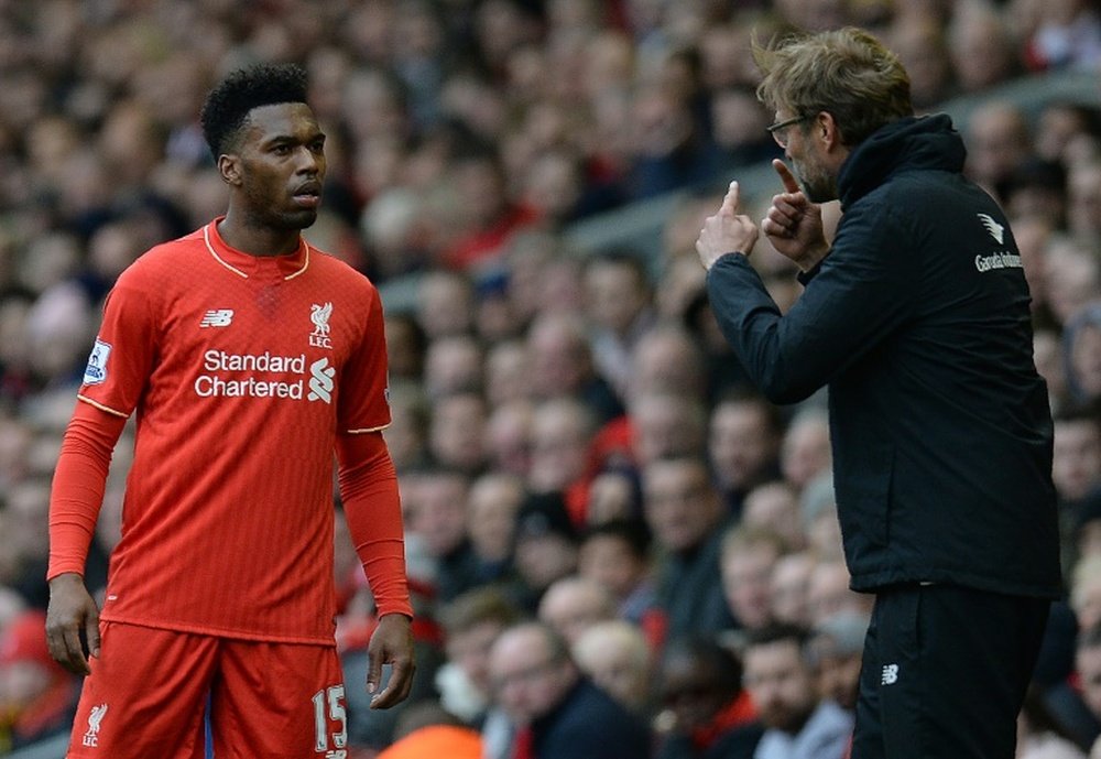 Sturridge (L) was left out of Liverpool's first XI against Tottenham on Saturday. AFP