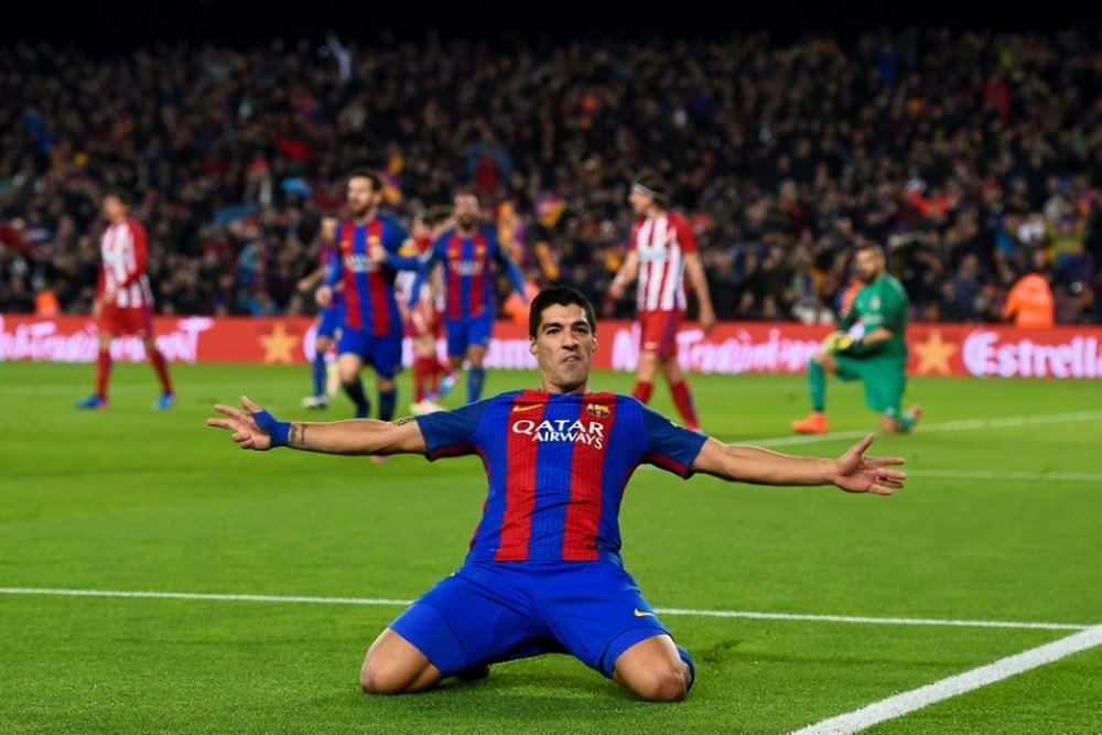 Barcelona forward Luis Suarez celebrates after scoring the opener against Atletico. AFP