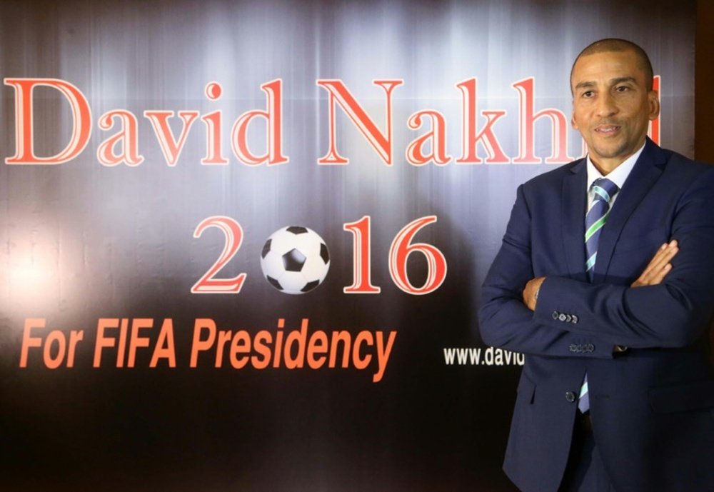 Former Trinidad and Tobagos football player David Nakhid in front of a poster during a press conference to launch his bid to succeed FIFA president Sepp Blatter on September 28, 2015 in the Lebanese capital Beirut