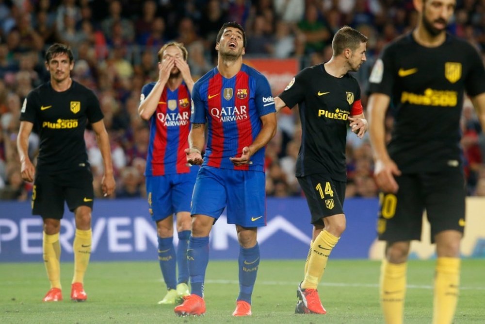 La afición del Atlético no entiende la actitud de Suárez. AFP/EFE