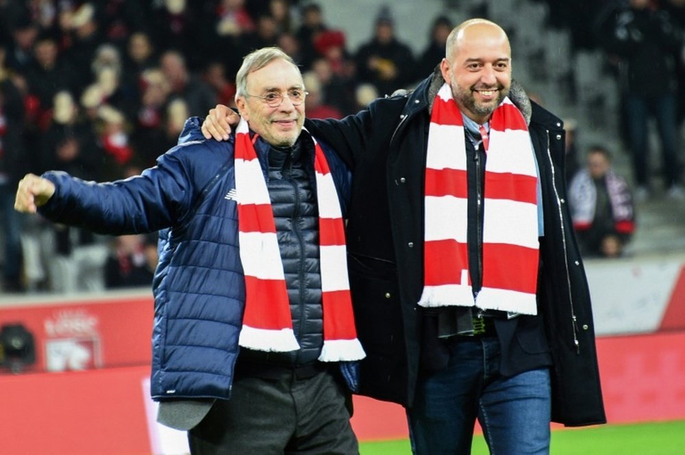 Lille's outgoing president Michel Seydoux (left) with new president Gerard Lopez. AFP