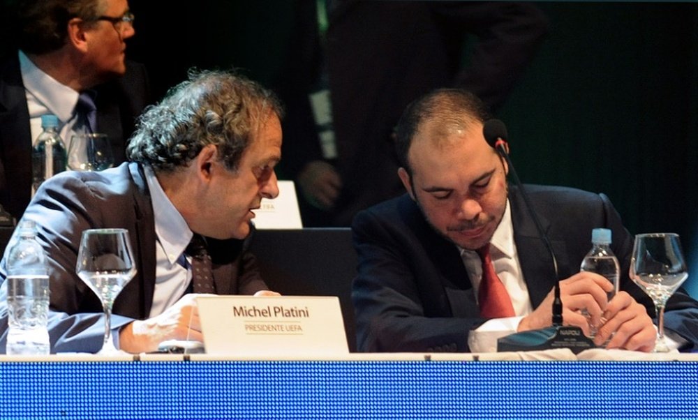 Michel Platini (left) and Prince Ali chat at a meeting of CONMEBOL, at the South American confederation, in Luque, near Asuncion on March 4, 2015