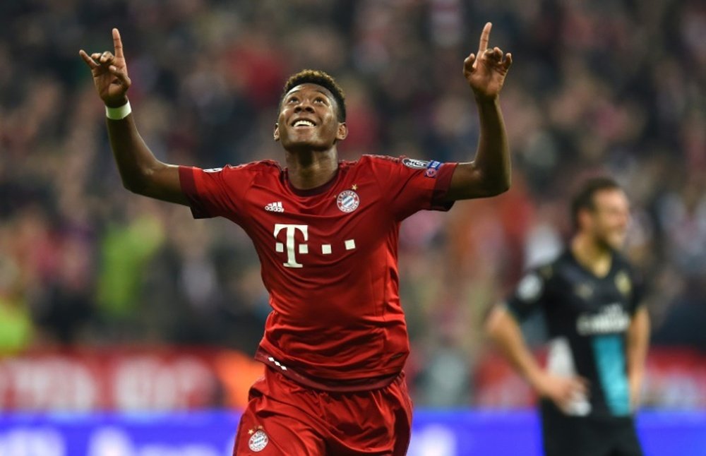 Bayern Munichs Austrian defender David Alaba celebrates after scoring the third goal during the UEFA Champions League Group F second-leg football match between FC Bayern Munich and Arsenal FC in Munich, southern Germany, on November 4, 2015