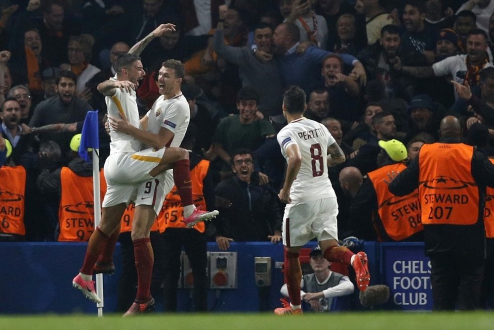 Edin Dzeko celebrates after scoring his second goal against Chelsea. AFP