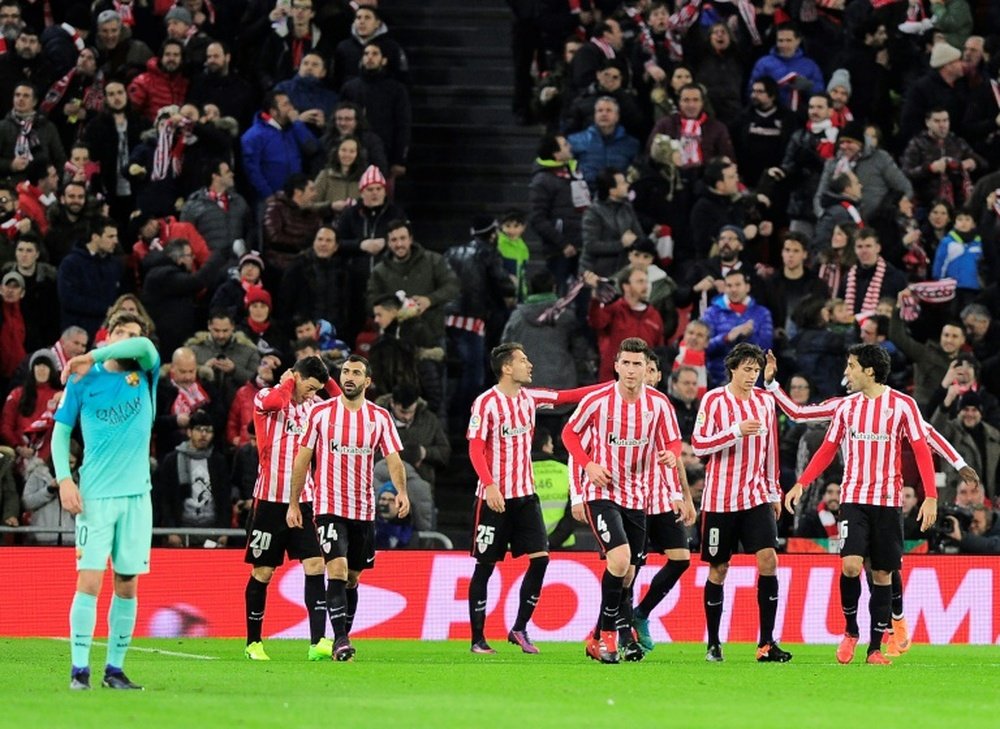 Athletic Bilbaos players celebrate after Athletic Bilbaos forward Aritz Aduriz scored his teams first goal during the Spanish Copa del Rey round of 16 first leg match against FC Barcelona at the San Mames stadium in Bilbao on January 5, 2017