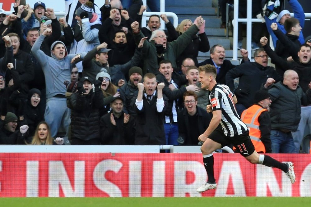 Ritchie celebrates scoring a goal for Newcastle against Manchester United in February 2018.  AFP