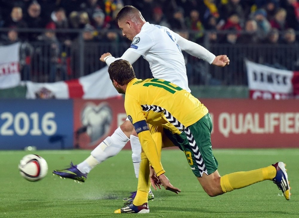 Englands Ross Barkley (R) scores a goal next to Lithuanias Mindaugas Panka during a Euro 2016 Group E qualifying football match at LFF stadium in Vilnius on October 12, 2015