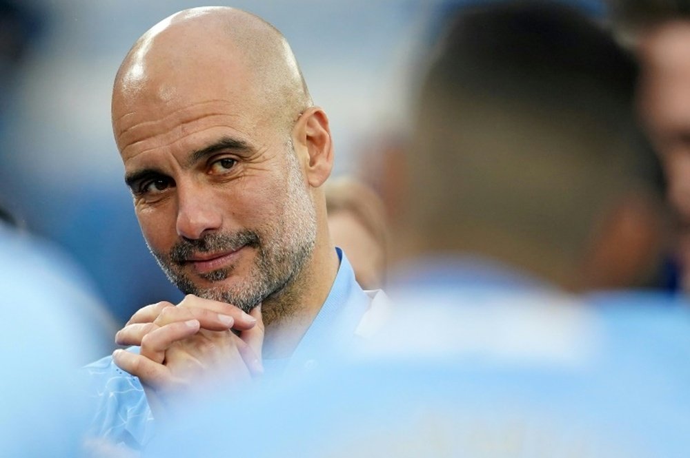 Laporta wants Guardiola to return to the Camp Nou. AFP