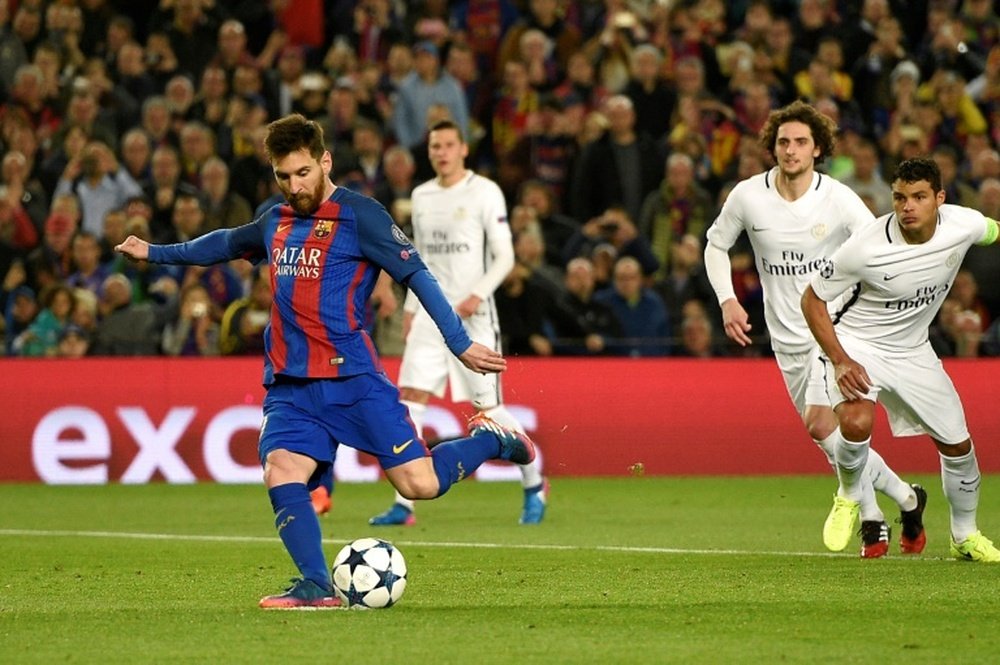 Lionel Messi kicks to score on a penalty . AFP