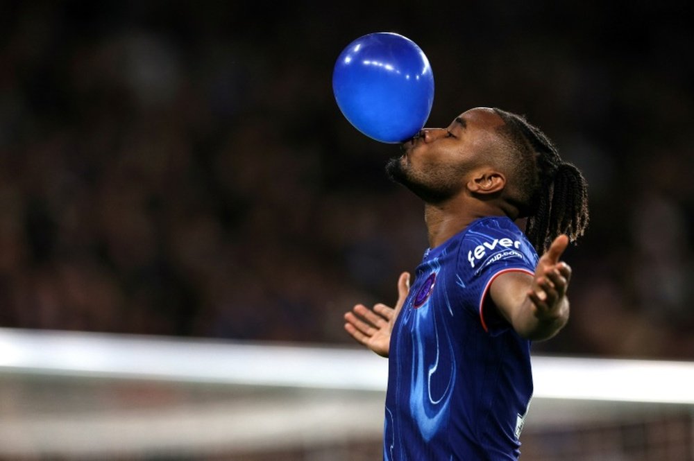 Christopher Nkunku celebrated on his way to a hat-trick in Chelsea's 5-0 win. AFP