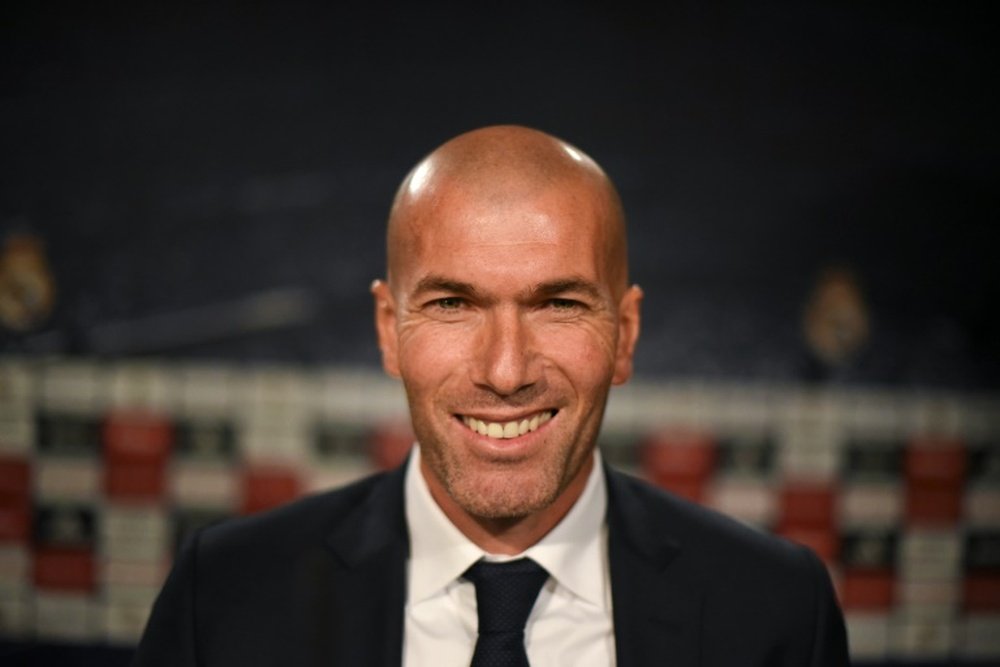 Real Madrids new coach Zinedine Zidane (L) poses before a press conference at the Santiago Bernabeu stadium in Madrid on January 5, 2016