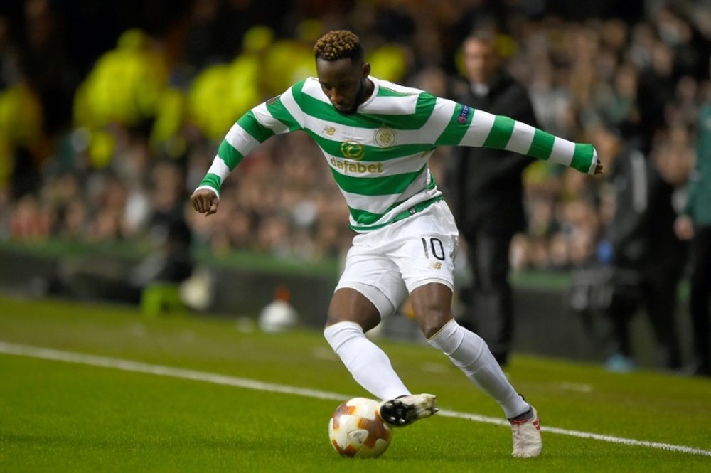 Dembele gave Celtic a two goal cushion before the red card. AFP
