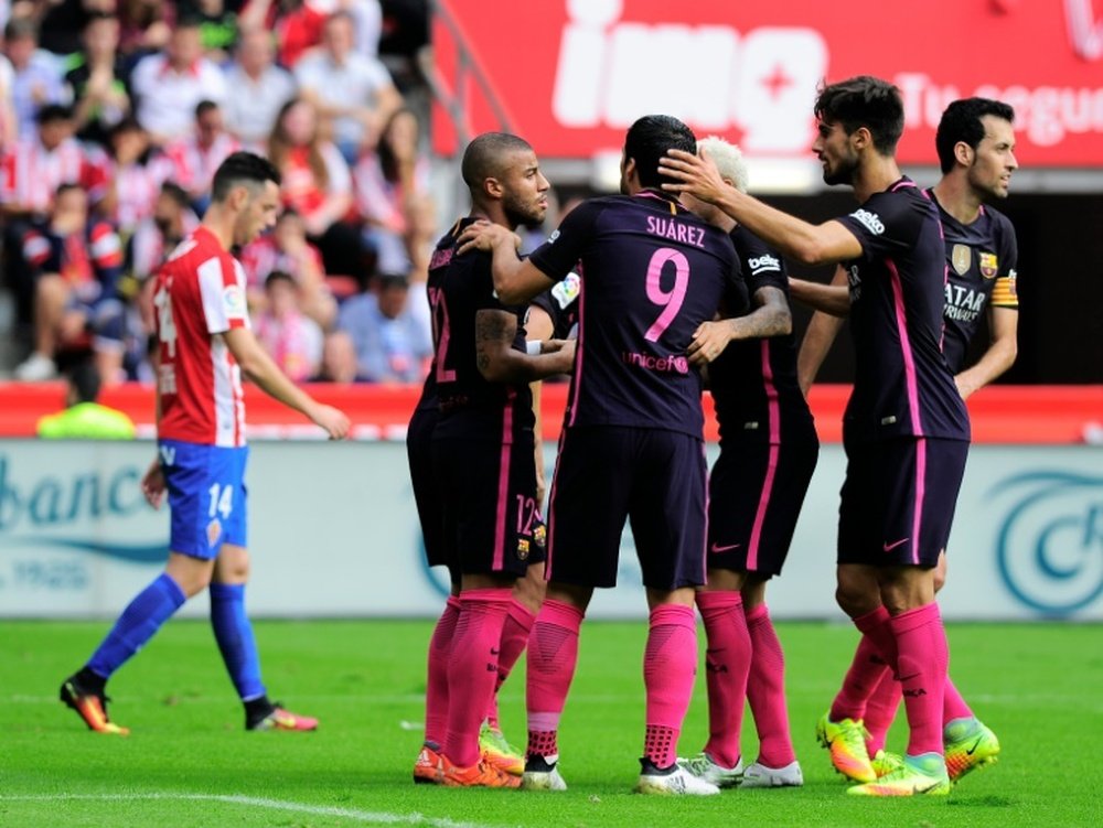 Rafael Alcantara is congratulated by teammates after scoring a goal against Sporting de Gijon. AFP